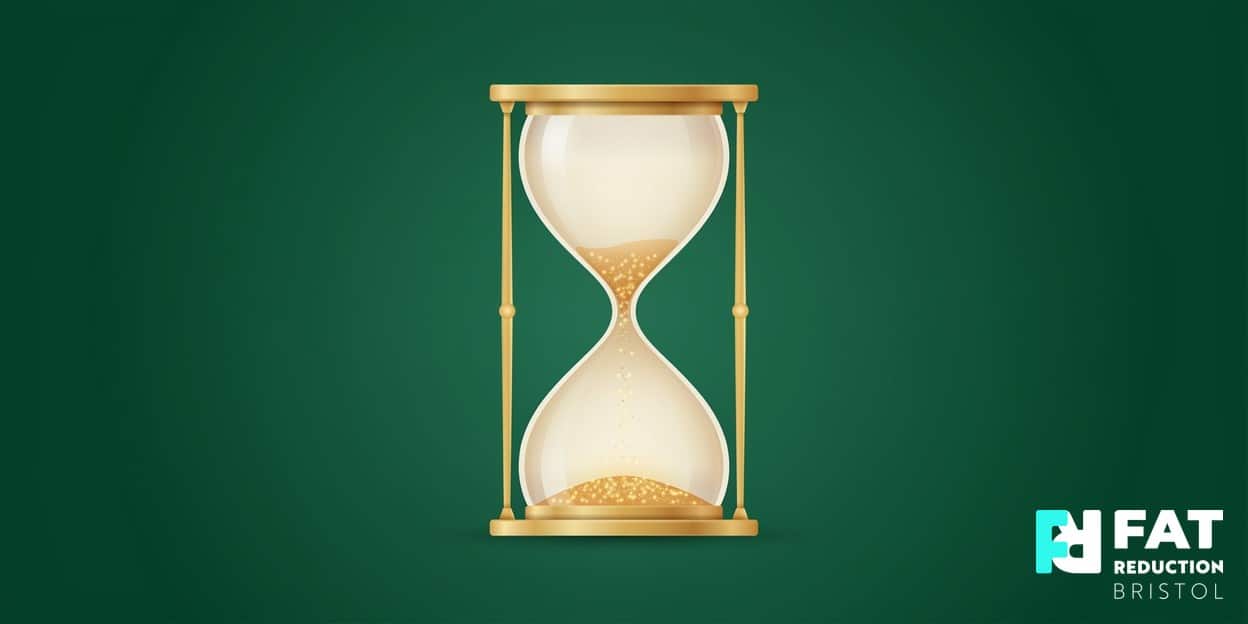 A flat-vector illustration of a single elegant hourglass with a warm-gold glow, on a bold forest-green background